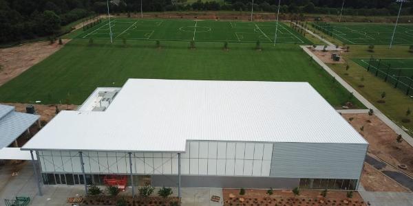 Growing soccer scene scores with metal panels