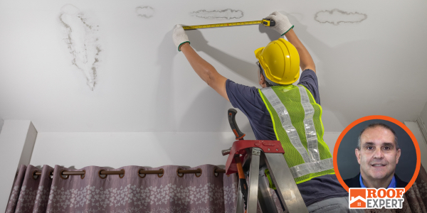Person in high vis jacket and hard hat investigating water damage, John Kenney’s headshot overlayed in bottom right