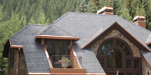 A house in the woods with a DaVinci composite slate roof