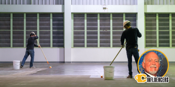 Two people using rollers to coat a concrete warehouse floor, Joe Sorrentino’s headshot in the bottom right