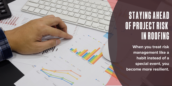 Hand pointing at graphs on a paper