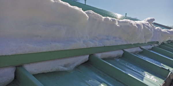 Snow retention systems for enhanced roof safety
